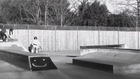 Teens Do Bike Tricks at Skate Park