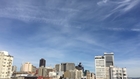 F-22 & P-51 Mustang flying over San Francisco for Fleet Week