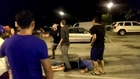 Dude drops 2 guys in parking lot, night night.