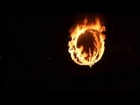 Jump through fire ring during Kalaripayattu martial arts demonstration (Kerala, India)