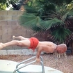 Gymnast Does Handstands on Pool Ladder