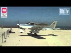 Plane lands on sunbather on beach