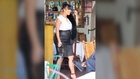 Kim Kardashian Tries (and Fails) To Beat The Heat In Tight, Long Skirt