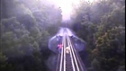 Two women narrowly escape death on railroad tracks