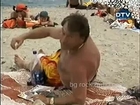 hidden camera - excited man on the beach